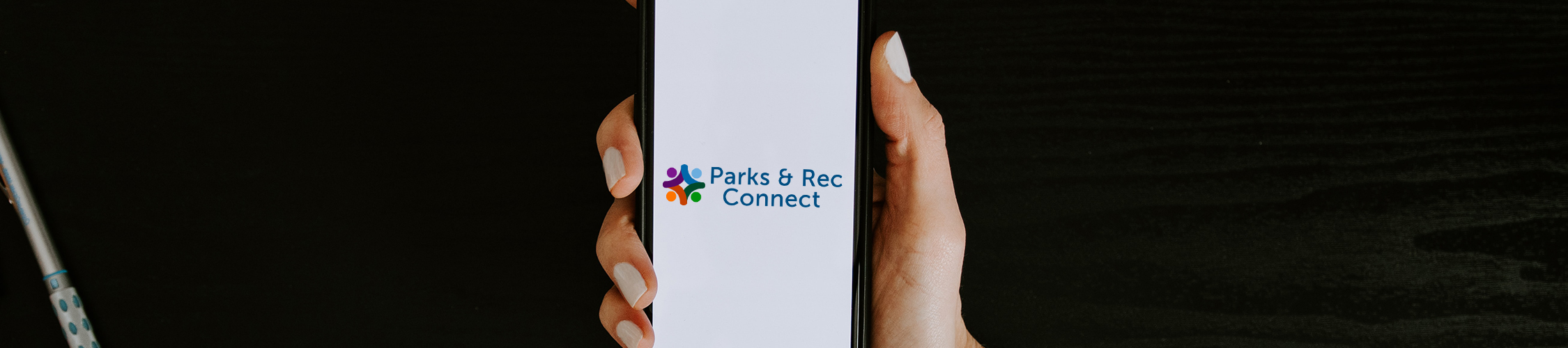 Mobile Phone with Parks and Rec Connect on screen